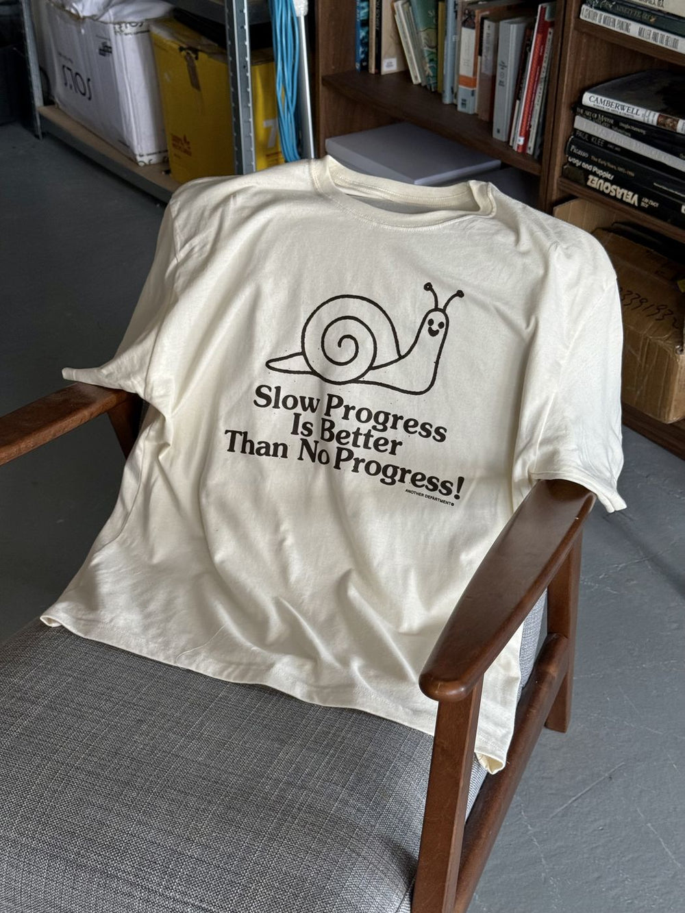 Slow Progress tee on a chair